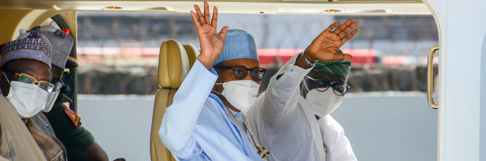 Nigerian President Muhammadu Buhari and Lagos Governor Babajide Sanwo-Olu wave from the presidential helicopter, Lagos, Nigeria